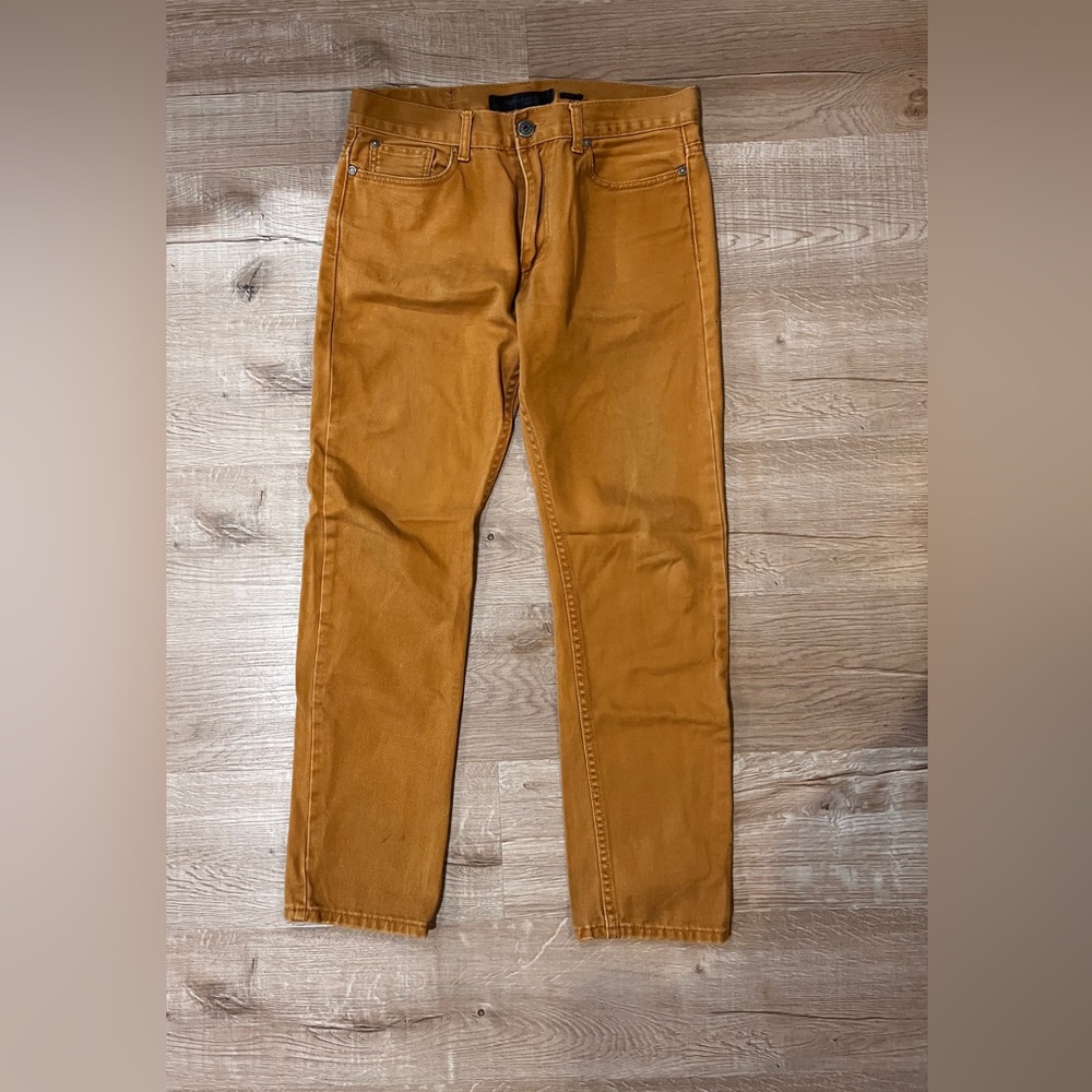 Men's rustic orange jeans